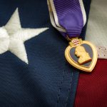 The Purple Heart is a United States military decoration awarded in the name of the President to those wounded or killed while serving and the american flag (Getty Images)
